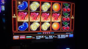 Diamond Empire slot game interface showing wealth-themed reels and stacked symbols on sinaga4d